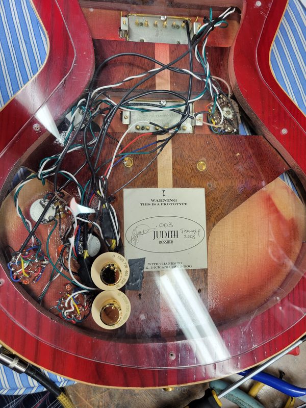 Complex guitar wiring repair inside a prototype guitar control cavity